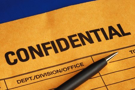 Pen on the confidential envelope isolated on blueの写真素材
