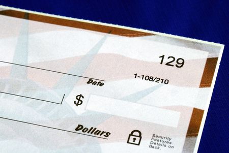 Write the dollar amount on the check isolated on blueの写真素材