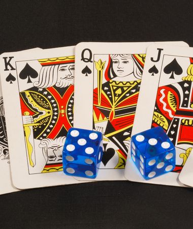 Blue dices on poker cards concepts of gambling or taking a riskのeditorial素材