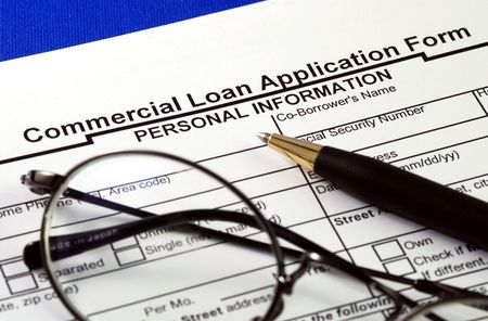 File the commercial loan application isolated on blueの写真素材