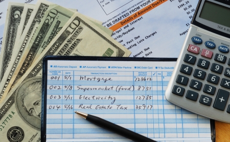 Write some checks to make payments for household expenses の写真素材