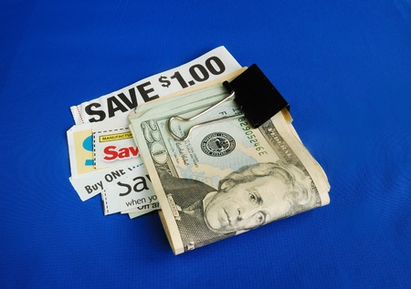 Cut up some coupons to save money の写真素材