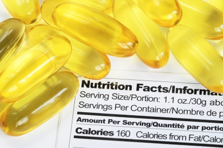 Nutrition label with fish oil pills concept healthy eatingの写真素材