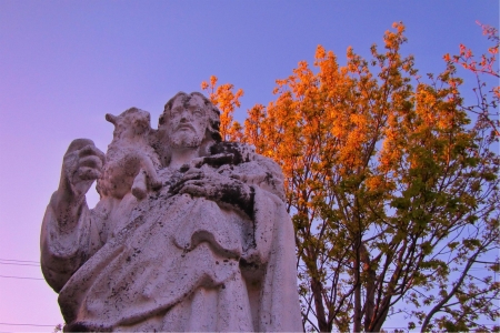 Old statue of Jesus with Lamb on his shoulder の写真素材