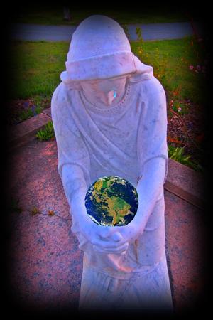 Mary embraces the earth and weeps for us allの写真素材