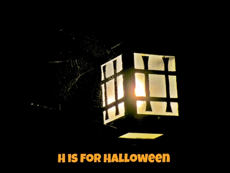 Lantern with spider web and Halloween textの写真素材