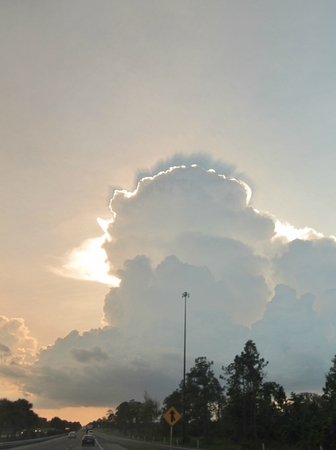 Mushroom cloud in front of sun.の写真素材