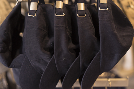 Dark Blue Baseball Hats hanging In A Rowの写真素材