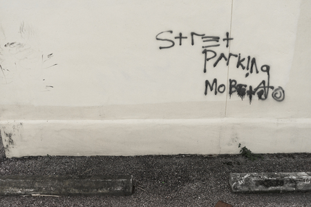 Street Parking Graffiti On Wall Downtownの写真素材