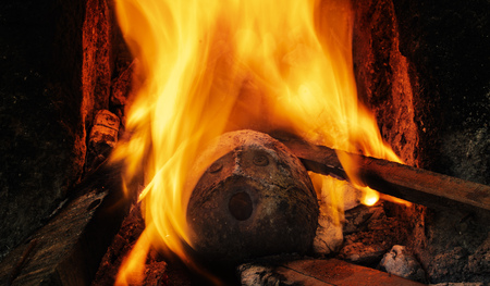 burning coconut shell faceの写真素材