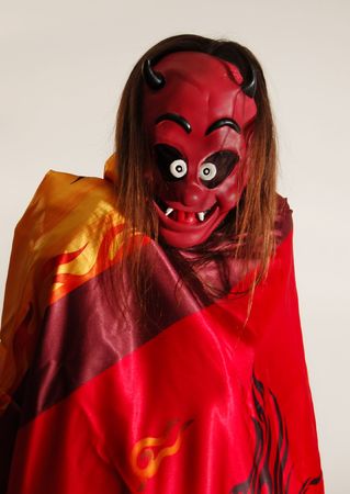 Long hair man in devil mask. Time to Halloween Partyの写真素材