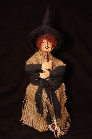 Witch with broom and hat. Isolated.