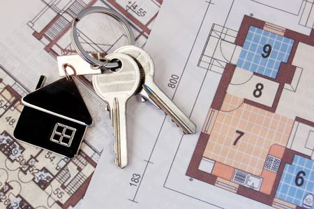 Keys with home on blueprintsの写真素材