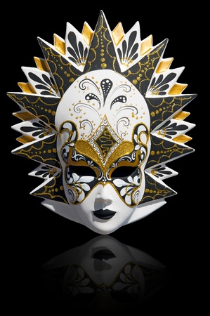 Gold traditional venetian carnival mask isolated on black. Venice, Italy.の写真素材