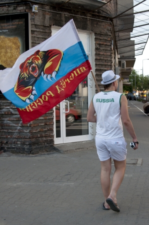 WARSAW, POLAND - JUNE 16: Russian fan with flag at Warsaw street  before UEFA EURO 2012 Russia vs. Greece football match, June 16, 2012 in Warsaw, Polandのeditorial素材