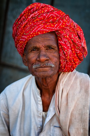 Indian man with mustache in traditional colorful turban portrait Pushkar India. March 3 2013のeditorial素材