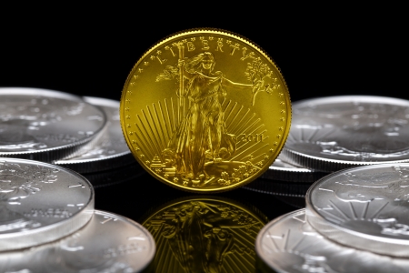 Uncirculated 2011 American Eagle Gold Coin with American Eagle Silver Coins.の写真素材