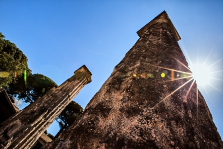 Ancient column with a sun starburstの写真素材