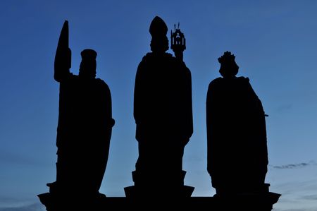 Silhouette of statue on Charles Bridge, Prague, Czech Republic.の写真素材