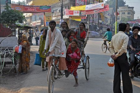 Amritsar, India â€“ 29 October, 2009: An unidentified group of people travel by rickshaw in...