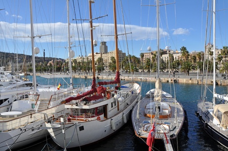 Yachts at Port Vell in Barcelona during the sunny day.