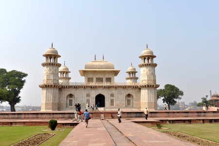 AGRA, INDIA - 2 NOVEMBER, 2009: Tourists walk in the front of the finest example of Mughal architecture - Itmad-ud-Daulas Tomb, on November 2, 2009. Sometimes called the Baby Taj, the tomb is often regarded as a draft of the Taj Mahal.のeditorial素材