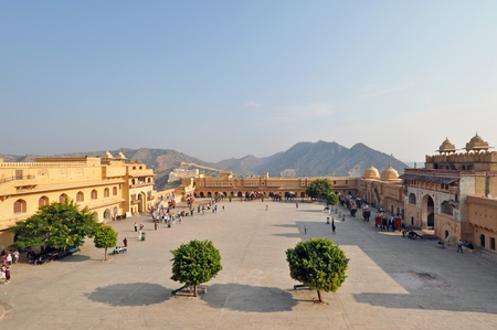 AMBER, INDIA - 4 NOVEMBER, 2009: Tourists admire Amber Fort with elephants on November 4, 2009. Amber Fort is known for its unique artistic style, blending both Hindu and Mughal elements, and its ornate and breathtaking artistic mastery.のeditorial素材