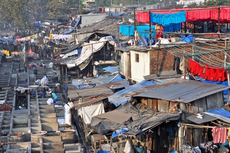 DELHI, INDIA - 5 NOVEMBER, 2009: An unidentified Indian people work at Dhobi Ghat in Mumbai on November 5, 2009. Dhobi Ghat is the the world's largest outdoor laundry and work there nearly 200 dhobi families.のeditorial素材