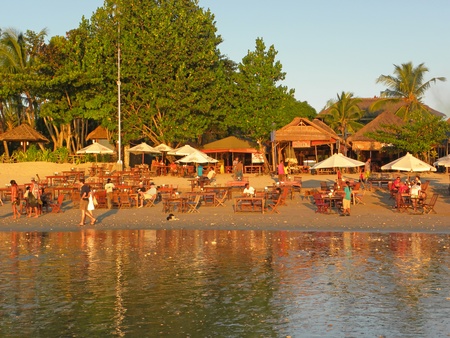JIMBARAN, BALI - 8 JULY: Aerial view of romantic beach restaurant with beautiful sunset sea view on July 8, 2009 in Jimbaran, Bali. Beach restaurants are the most popular among tourists.のeditorial素材
