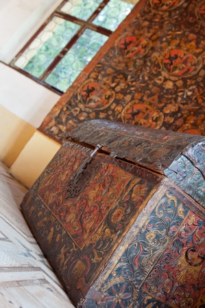 Detailed view of a colorful carved chest in a castle.のeditorial素材