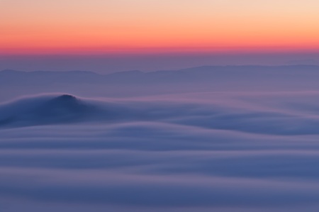 View of a beautiful misty morning on the top of the hill.の写真素材