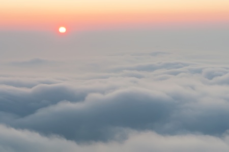 View of a beautiful misty morning on the top of the hill.