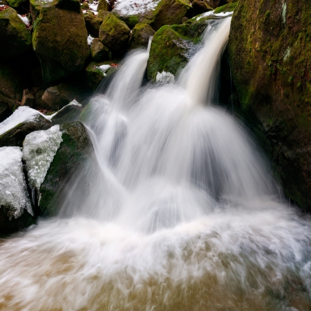 Panoramic view of a beautiful winter waterfall.の写真素材