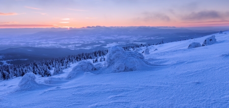 View of winter wonderland during the sunset time, panoramic picture.の写真素材