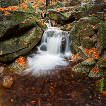 Panoramic view of a beautiful autumn waterfall.の写真素材