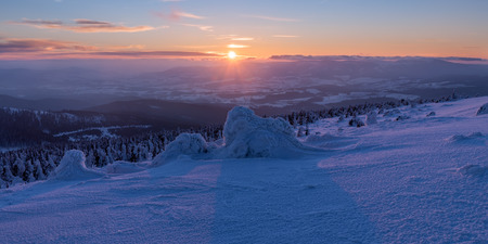 View of winter wonderland during the sunset time, panoramic picture.の写真素材