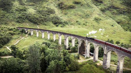 Aerial photo of famous steam train on glenfinnan viaductの写真素材