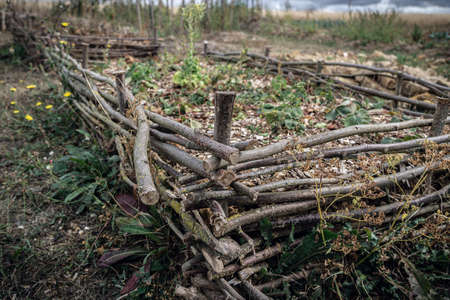 flower bed made of twigs in permaculture gardenの写真素材