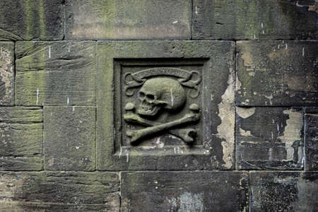 Memento Mori sign in mossy stone wall at Greyfriars Kirkyardの写真素材