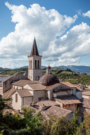 A church with a mountain in the background in Spoleto Italyの写真素材