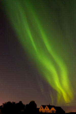 Aurora borealis above houses of old ReykjavÃ­kの写真素材