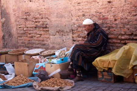 Old man selling dried fruits and nuts on street of Marrakechのeditorial素材