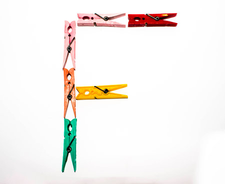 letter F formed with a series of clothespinsの写真素材