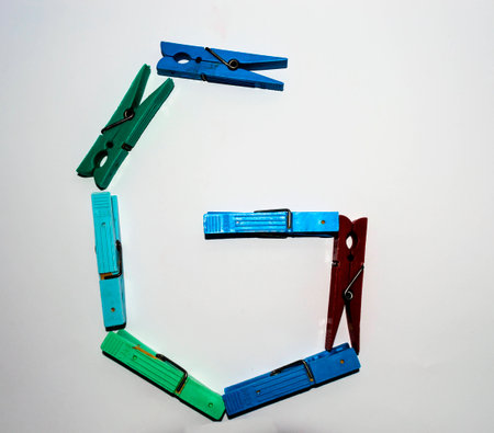 letter G formed with a series of clothespinsの写真素材