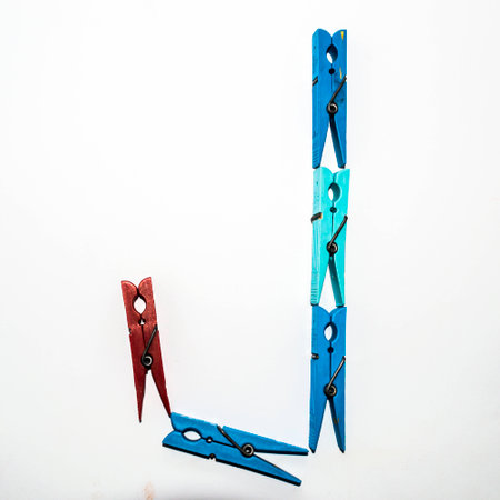 letter J formed by a series of clothespins