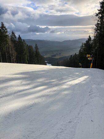 Empty ski slope with snow in the Czech mountainsの写真素材