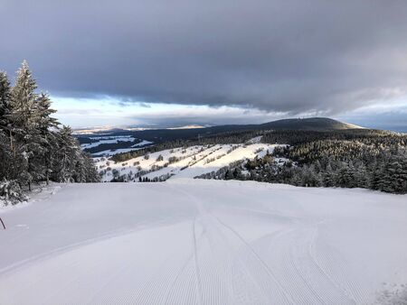 Empty ski slope with snow in the Czech mountainsの写真素材