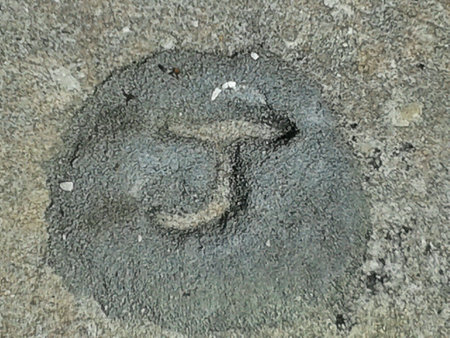 The letter J etched in stoneの素材