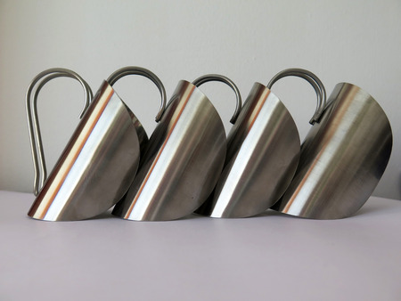 Metal handled glass holders in artistic arrangementの写真素材