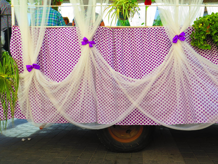 Curtains and bows on Purple Polkadot Float at local fiesta in Alora, Andaluciaの写真素材